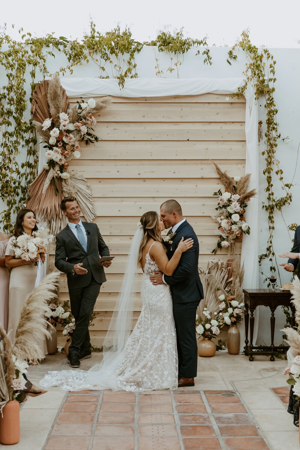 Lush ceremony arch and aisle florals